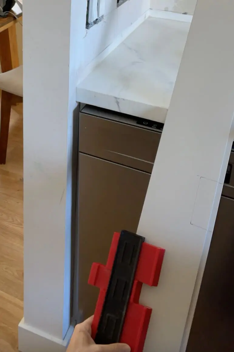 Using a contour gauge during kitchen remodel.